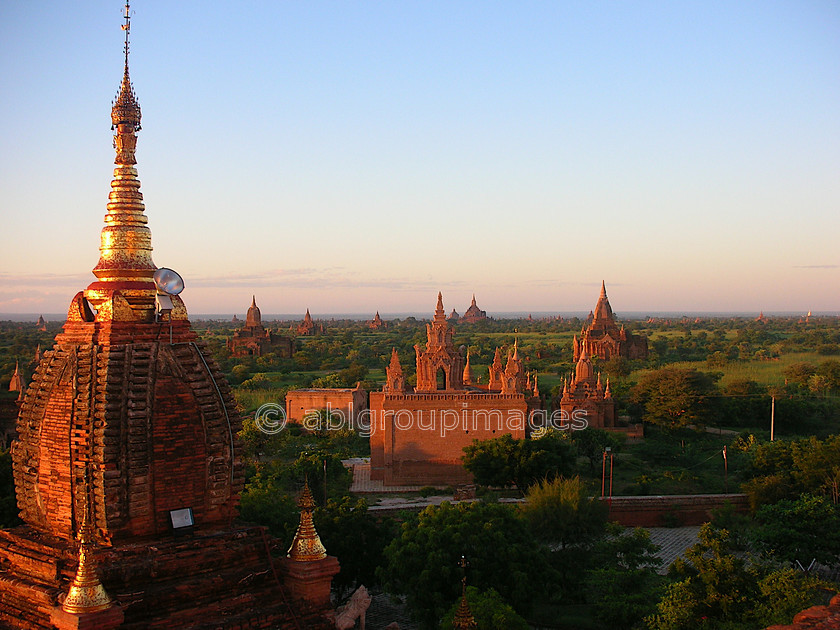 Burma - 01362 
 Stupas and Nats in the evening sunlight, Bagan Plain 
 Keywords: Myanmar, Stupa, building, Bagan, architecture, religious building, Sunset, Asia, Burma