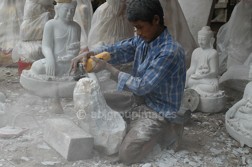 Burma - 00686 
 Central Mandalay - Marble stone carvers workshops 
 Keywords: Man, artist, male, Asia, Bagan, Myanmar, OCCUPATION, stone sculpture, sculptor, Burma, Portrait