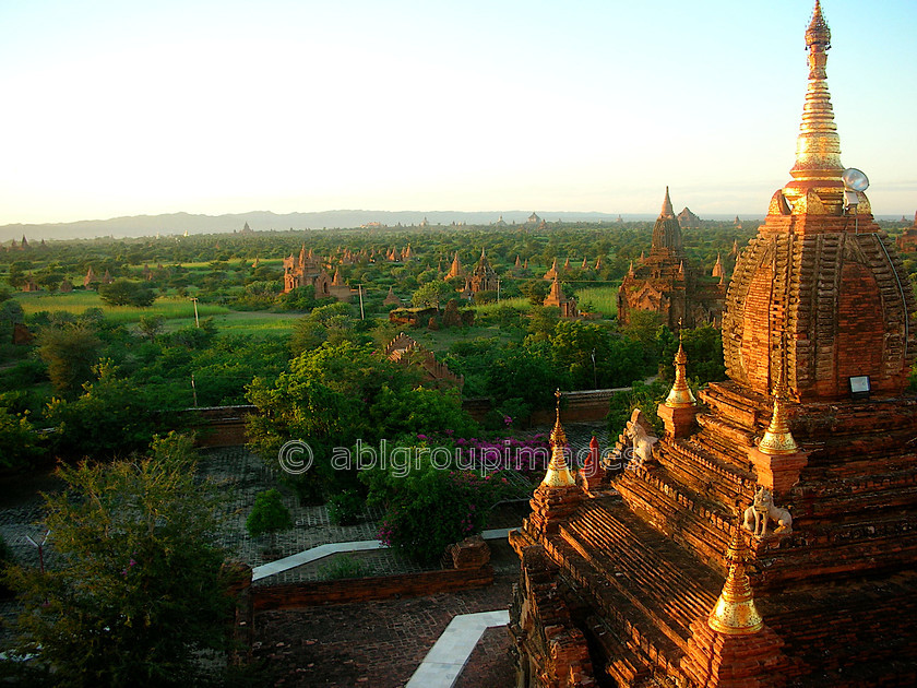 Burma - 01361 
 Stupas and Nats in the evening sunlight, Bagan Plain 
 Keywords: Burma, Stupa, building, Sunset, religious building, Asia, architecture, Bagan, Myanmar