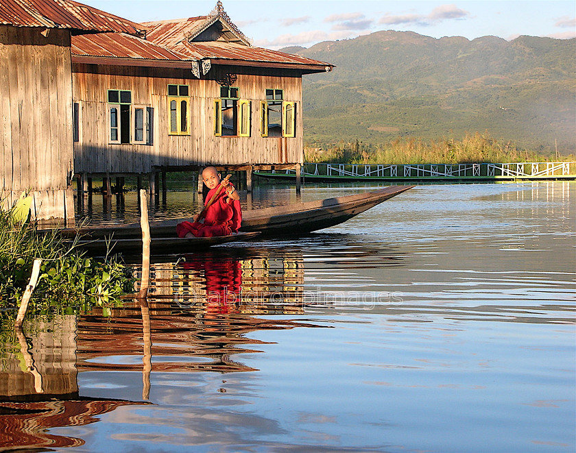 Burma - 01834 
 Inle Lake - Boy Monk on boat 
 Keywords: Asia, Burma, , Inle Lake, lake, monk, Myanmar, OCCUPATION, PEOPLE, religion, scenery, water,