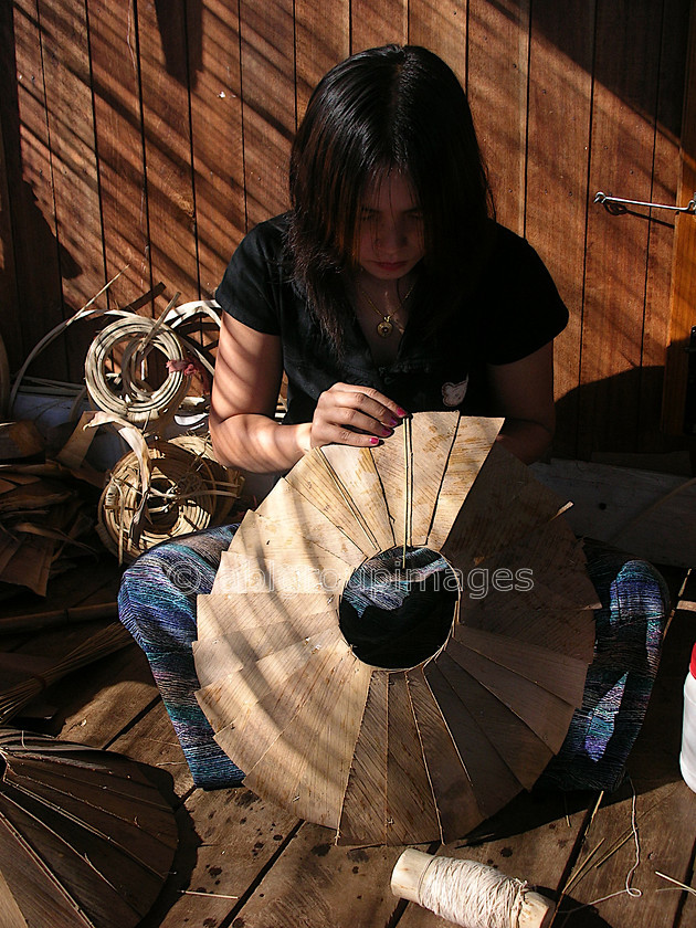 Burma - 01787 
 Inle Lake - Young girl making umbrella 
 Keywords: Burma, Asia, Woman, Portrait, Myanmar, female, women