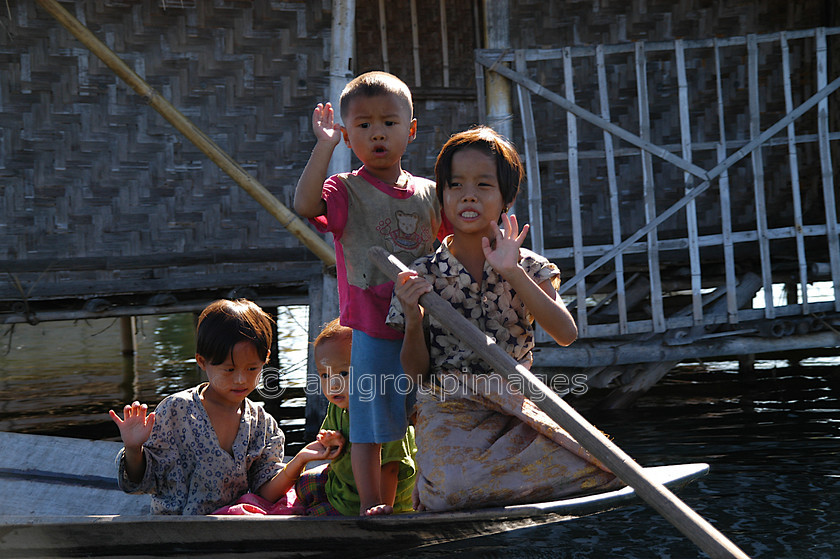 Burma - 01623 
 Inle Lake - Children on canoe 
 Keywords: male, Portrait, Children, Myanmar, Burma, female, Asia