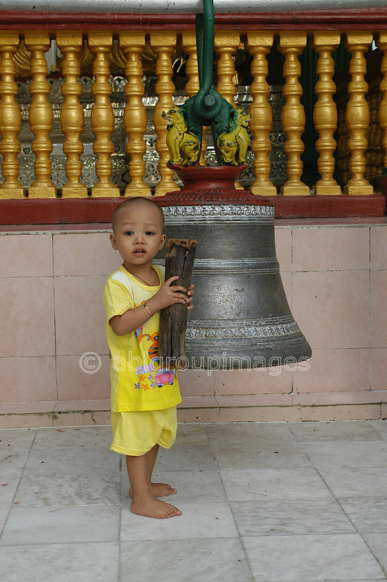 Burma - 00208 
 Lttle boy about to ring the bell at The Shwedagon Paya, Yangon. 
 Keywords: male, Buddhism, Boy, Asia, Burma, Myanmar, Yangon, religion