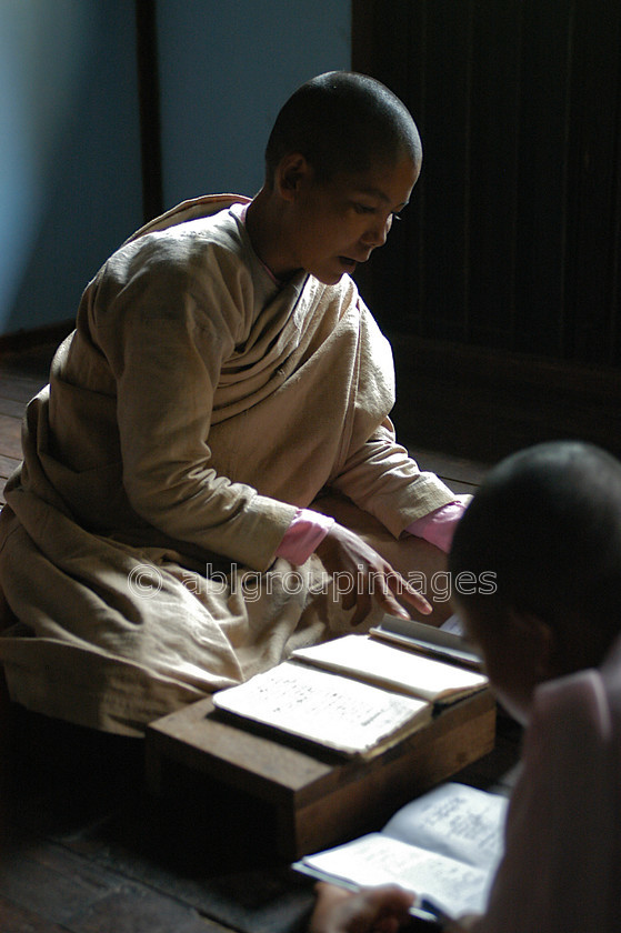 Burma - 01013 
 Teacher in the classroom, Tha Ka Nunnery, Hills of Sagaing Tour Kay Mar 
 Keywords: OCCUPATION, Bagan, nun, Portrait, Myanmar, religion, Girl, Burma, Asia