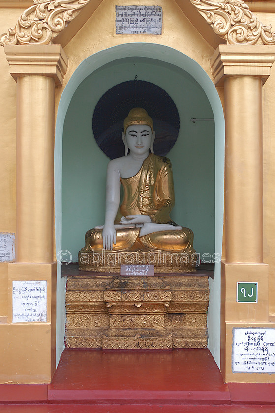 Burma - 00146 
 Buddha statue at The Shwedagon Paya, Yangon. 
 Keywords: religion, religious building, Yangon, Burma, Asia, Myanmar, building, architecture, Buddhism