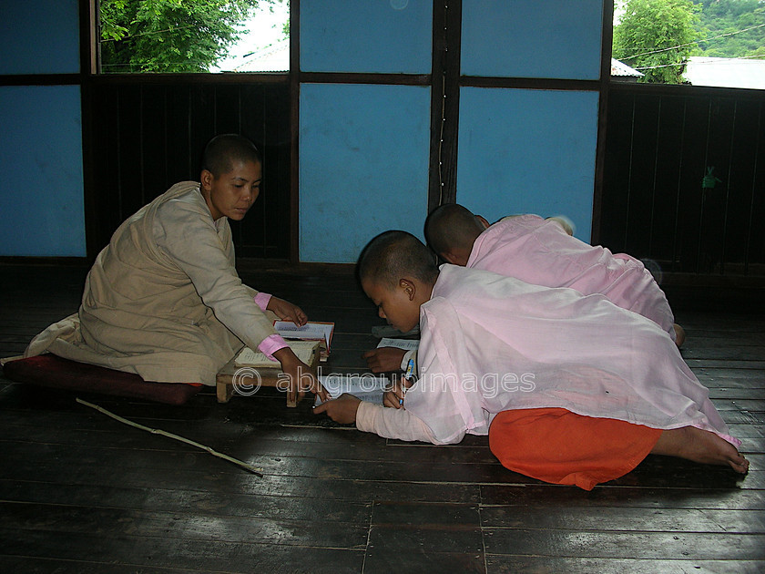 Burma - 00990 
 Nuns in the classroom studying, Tha Ka Nunnery, Hills of Sagaing Tour Kay Mar 
 Keywords: Burma, Girl, Asia, Myanmar, nun, Bagan, religion, Portrait, OCCUPATION