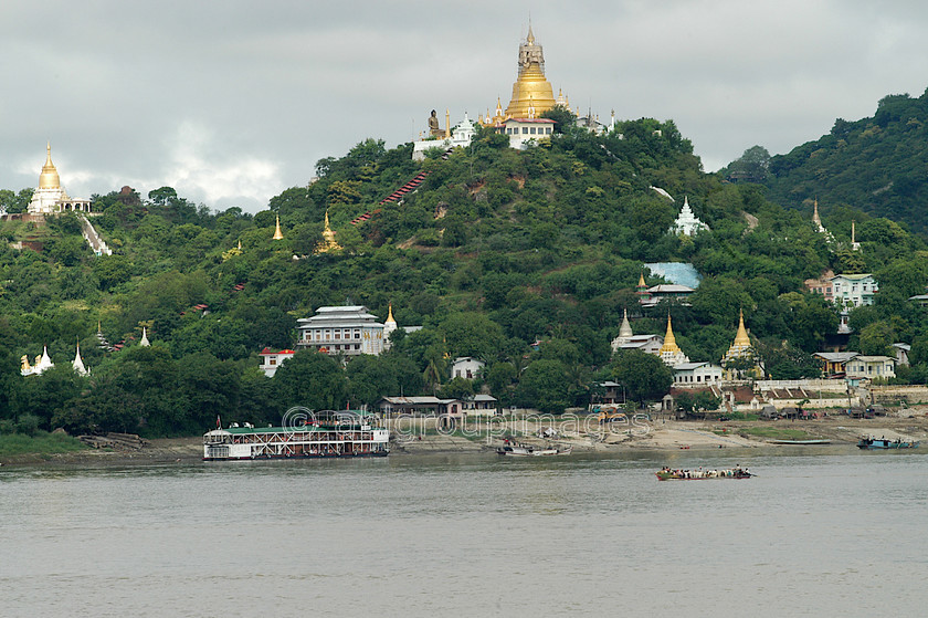 Burma - 01064 
 Gold top stupas seen from Ayeyarwady River 
 Keywords: Myanmar, Ayeyarwady River, Asia, Burma, Bagan