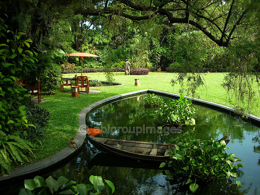 Burma - 00006 
 Governor's Residence Hotel, Yangon (35 Taw Win Road) Garden with pond and gardner 
 Keywords: Myanmar, Asia, Burma, Yangon