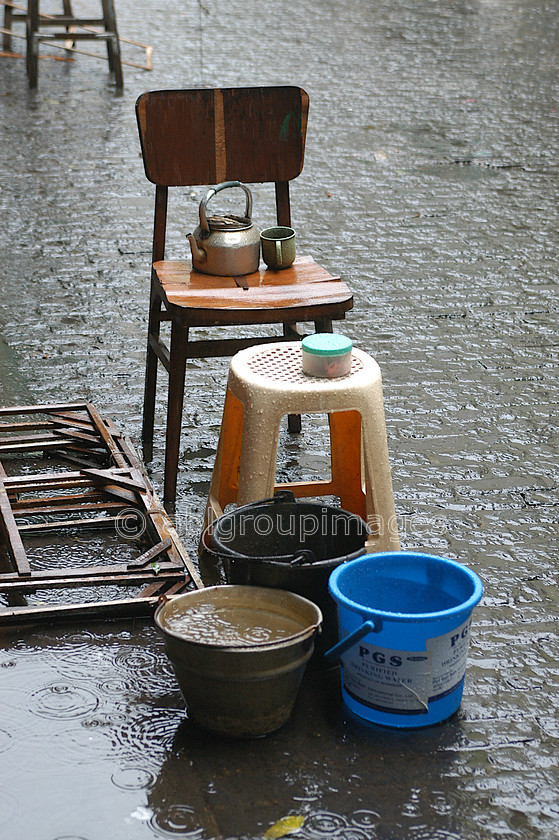 Burma - 00085 
 Teapot on stall abandoned becuase of the rain Bogyoke Aung San Market - 70 Year old Market (British Name: Scott Market) 
 Keywords: Yangon, Asia, Market, Myanmar, Burma