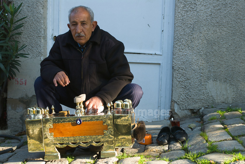 Turkey-152 
 Shoe shine at Sogukcesme Sk - next to Topkapi Palace 
 Keywords: Asia, Day, Europe, Imagefile-Gallery, Istanbul, Mediterranean, OCCUPATION, PEOPLE, Shoe Shine, street scene, Street Seller, Turkey, Whitewall-Gallery