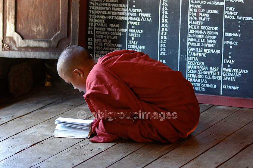 Burma - 01413 
 Young monk reading Inle Lake - Shwe Yan Pyay Monastery 
 Keywords: Myanmar, Asia, male, religion, Burma, monk, Portrait