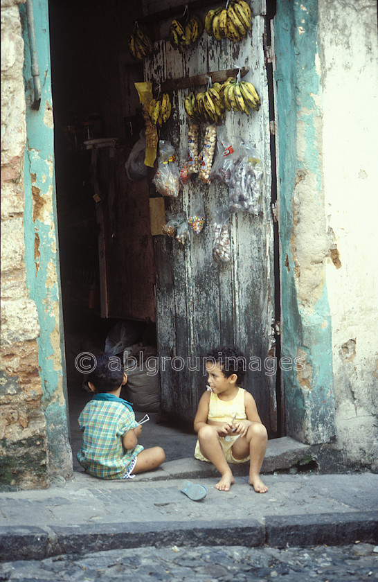 BRA323 
 Two children playing in a doorway in Rio de Janeiro 
 Keywords: children, South America, Brasil, Day, Portrait, Brazil, Rio de Janeiro