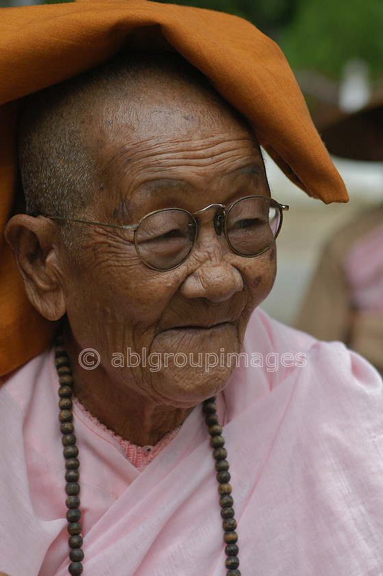 Burma - 00774 
 Portrait of an elderly nun, Mandalay - Mingun Tour 
 Keywords: Burma, nun, female, Myanmar, OCCUPATION, Portrait, Woman, Bagan, women, Asia, religion