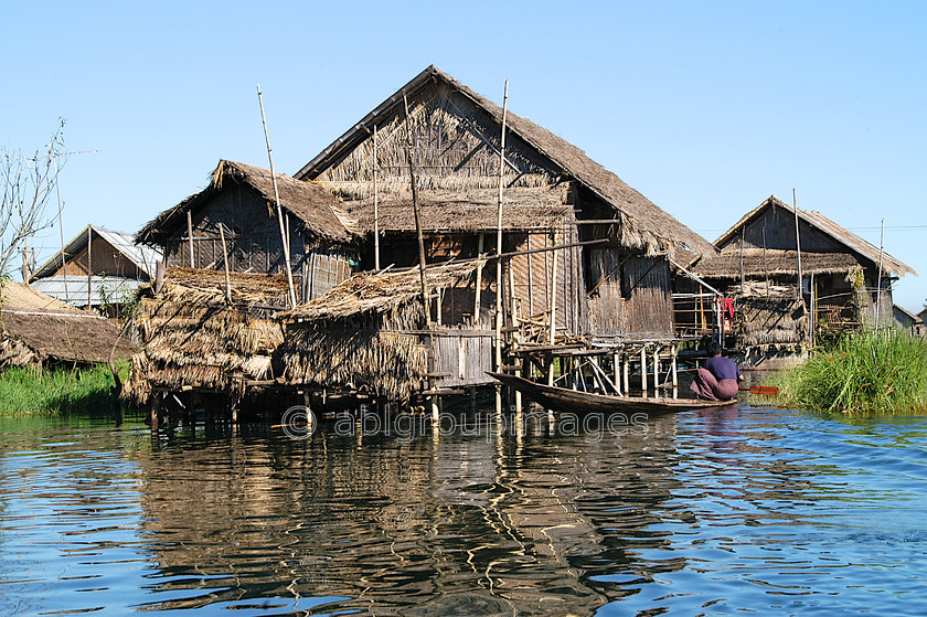 Burma - 01627 
 Inle Lake - House with man on canoe 
 Keywords: Burma, Myanmar, Asia