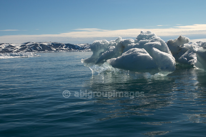 Arctic - 3045 
 Iceberg and reflection, South Hinlopen Strait , Svalbard 
 Keywords: iceberg, environment, Landscapes, scenery, Europe, Svalbard, Day, Arctic, Norway, Scandinavia, water