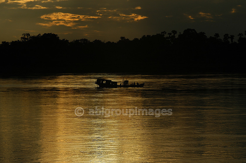 Burma - 01095 
 Boat on the Ayeyarwady River 
 Keywords: Asia, Ayeyarwady River, Burma, , Myanmar, river boat, river boats, Sunset, transportation, water transportation,