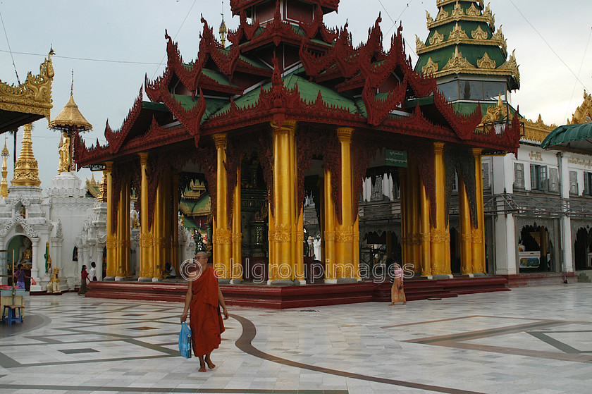 Burma - 00199 
 Shrines and Stupa's with monk at The Shwedagon Paya, Yangon. 
 Keywords: Myanmar, Yangon, Burma, architecture, Asia, religion, building, Buddhism, religious building