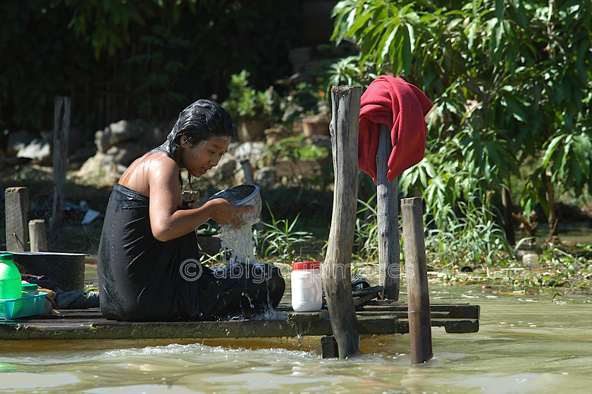 Burma - 01417 
 Inle Lake - Woman hair washing 
 Keywords: female, women, Burma, Portrait, Woman, Asia, Myanmar