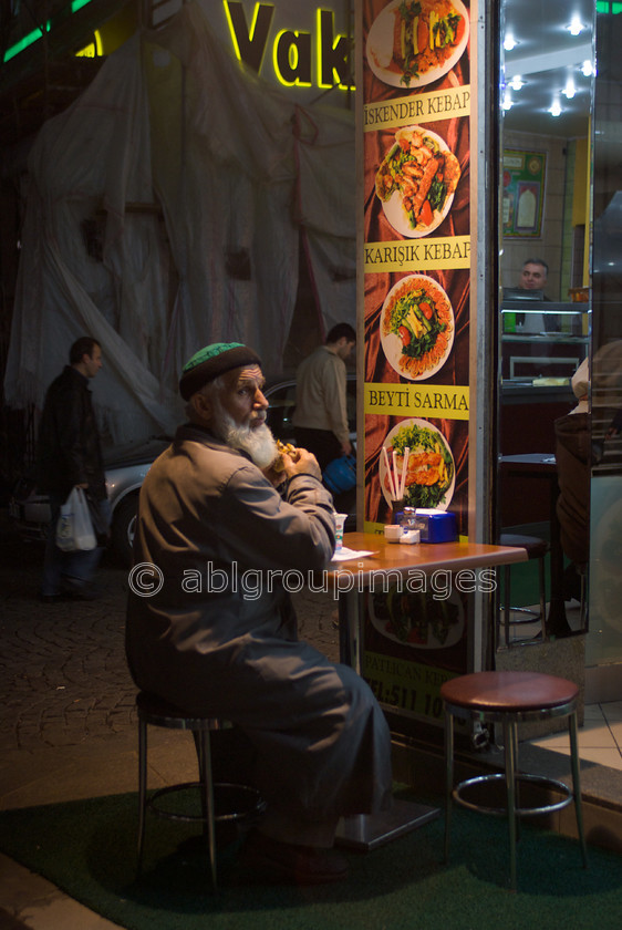 Turkey-138 
 Dinner in the Grand Bazaar 
 Keywords: ACTION MOTION, Asia, Day, eat, eating, Europe, Imagefile-Gallery, Istanbul, Man, Mediterranean, Night, Old Man, People, Turkey, Whitewall-Gallery