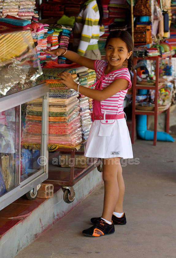 Cambodia -522 - Version 2 
 Girl in Market 
 Keywords: Asia, Cambodia, Child, Girl, , People, Siem Reap