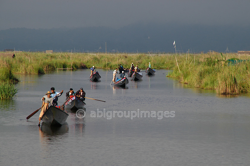 Burma - 01580 
 Inle Lake - canal with boats 
 Keywords: men, Burma, Asia, Myanmar