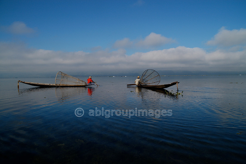 Burma - 01605 
 Inle Lake - two fisherman with bell nets on the lake 
 Keywords: Asia, boats, Burma, canoe, canoes, , fisherman, , Home, lake, Myanmar, OCCUPATION, PEOPLE, scenery, transportation, water, water transportation,