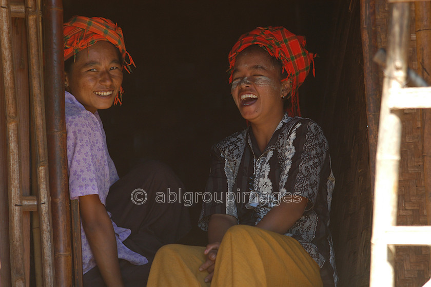 Burma - 01970 
 Inle Lake - Ladies sitting in a door way laughing 
 Keywords: Portrait, women, female, Burma, Asia, Myanmar, Woman