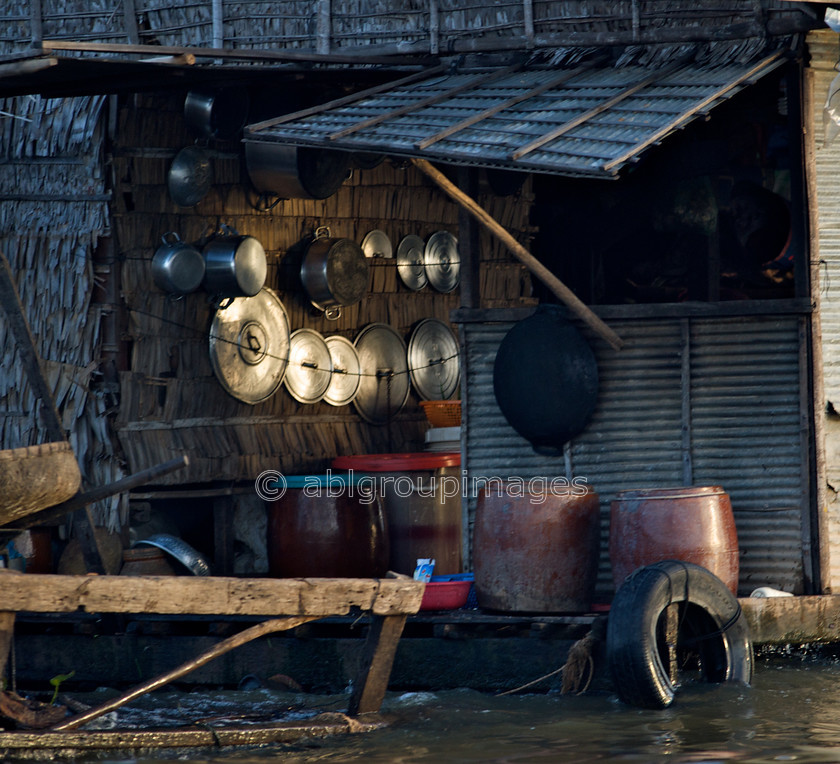 Cambodia -412 
 Kitchen Pans - at Floating Village of Chong Kneas on Tonle Sap 
 Keywords: Asia, Cambodia, , kitchen objects