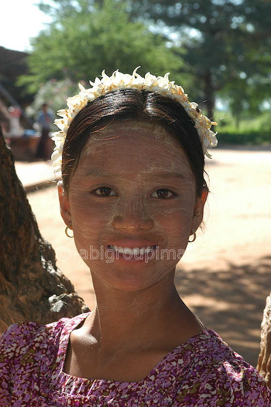 Burma - 00361 
 Flower seller at Shwesandaw Paya - Built by King Anarahta circa 1057 
 Keywords: Bagan, Portrait, Ayeyarwady River, female, Girl, Myanmar, People, Asia, Burma